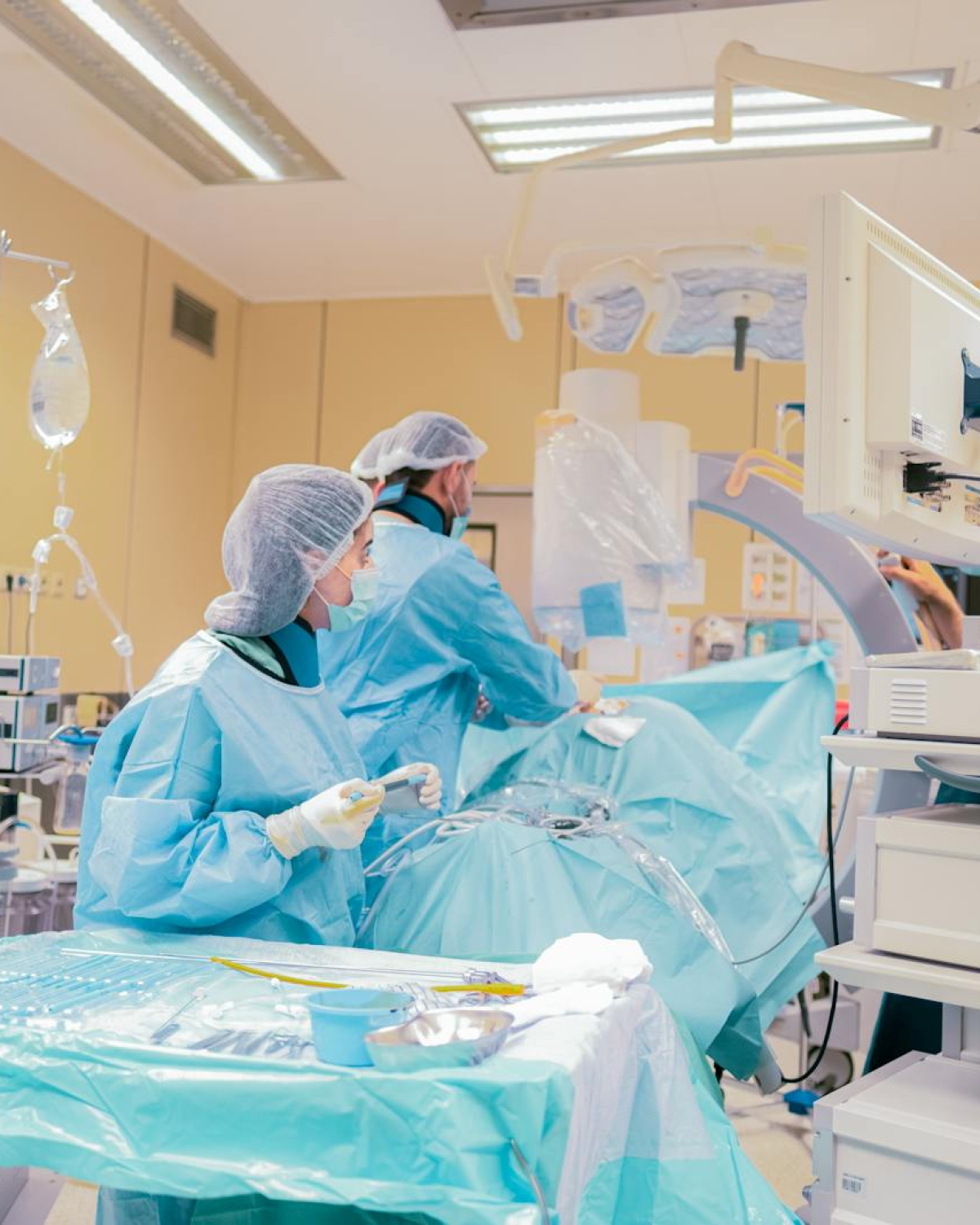 Surgical team in Baku, Azerbaijan operating room with advanced equipment and sterile environment.